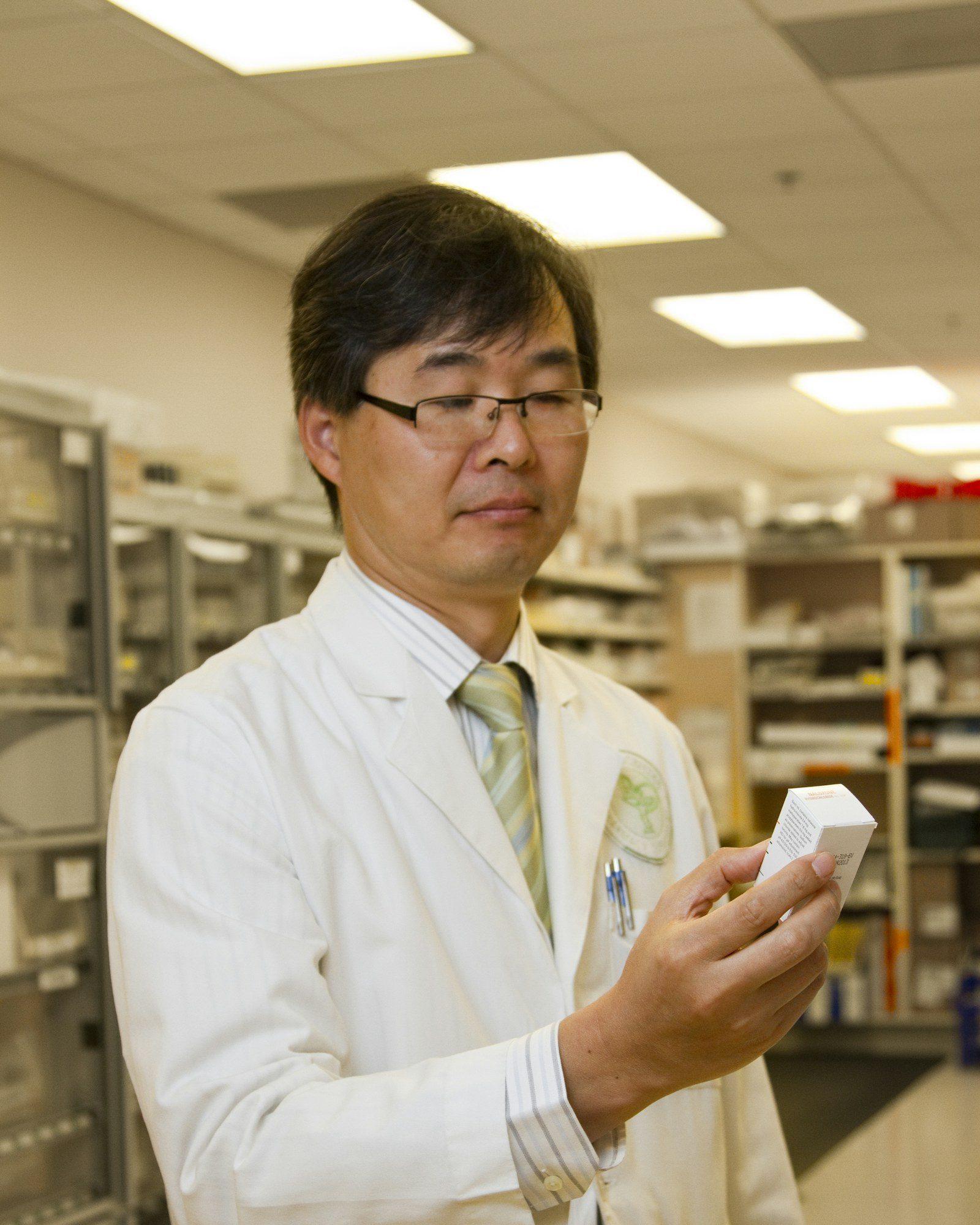 Pharmacist holding medicine